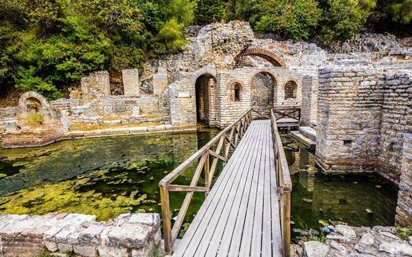 Butrint is one of the most important archaeological sites in the Mediterranean, featuring ruins from Greek, Roman, and Byzantine eras. Located on a peninsula between a lagoon and the sea, the park combines ancient history with lush natural beauty. Its well-preserved theater, basilica, and Venetian castle make it a fascinating destination for history enthusiasts.
