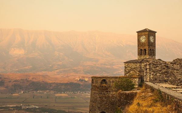 Gjirokastër is a UNESCO-listed "stone city" known for its unique Ottoman-era architecture and silver-roofed houses. The town is dominated by a massive fortress overlooking the Drino Valley. Walking through its steep, cobblestone bazaar feels like stepping back in time, offering a rich blend of history, Balkan culture, and spectacular mountain views.