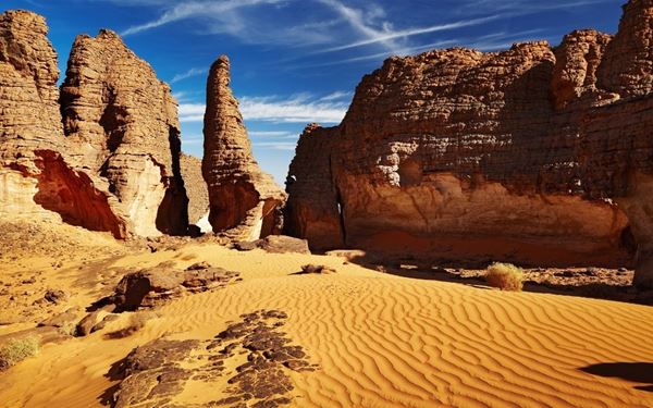 Tassili n'Ajjer is a vast plateau in the Sahara Desert, famous for its thousands of prehistoric rock paintings and engravings. The area features a "forest of stone" with incredible natural arches and pillars. It is one of the world's most important open-air museums of ancient human history, set within a lunar-like landscape of breathtaking scale and beauty.