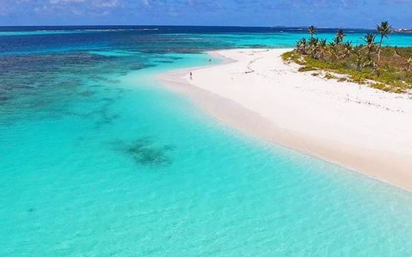 Shoal Bay East is frequently ranked as one of the best beaches in the world. It features two miles of shimmering white sand and turquoise waters perfect for snorkeling. The beach is lined with vibrant coral reefs and relaxed beach bars, offering a quintessential Caribbean experience that combines luxury with a serene, laid-back atmosphere.