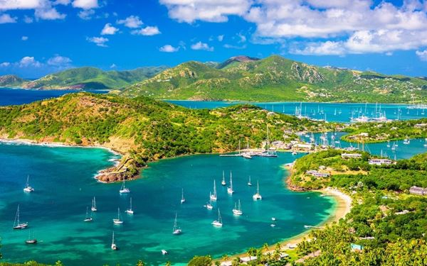 Shirley Heights is a restored military lookout famous for its spectacular panoramic views of English Harbour and Falmouth Harbour. It is most popular for its Sunday sunset parties, featuring local steel drum bands and barbecue. The combination of historical ruins, breathtaking vistas of the Atlantic Ocean, and a vibrant cultural atmosphere makes it the most iconic and social landmark on the island.