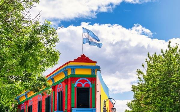 La Boca is a vibrant and colorful neighborhood in Buenos Aires, famous for its street "Caminito." This open-air museum is lined with brightly painted houses, tango dancers, and street artists. It reflects the city's immigrant history and its passionate artistic spirit. Visiting La Boca provides a sensory journey through the birthplace of the tango, filled with music, local crafts, and a lively urban atmosphere.