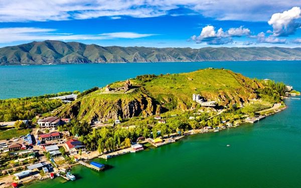 Known as the "Jewel of Armenia," Lake Sevan is one of the largest high-altitude freshwater lakes in the world. It is a popular summer retreat, offering sandy beaches and fresh crawfish. The Sevanavank Monastery, perched on a peninsula, provides a breathtaking panoramic view of the turquoise waters and the surrounding snow-capped mountains.