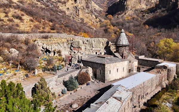 Geghard is a stunning medieval monastery partially carved into the adjacent mountain and surrounded by cliffs. Listed as a UNESCO World Heritage site, it is famous for its incredible acoustics and intricate stone carvings. The complex reflects the peak of Armenian medieval architecture and offers a deeply spiritual atmosphere in a dramatic natural setting.