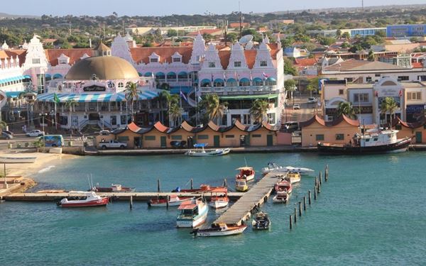 Oranjestad, the capital of Aruba, is a vibrant city characterized by its colorful Dutch colonial architecture and bustling harbor. The city offers a mix of high-end shopping, local markets, and historic landmarks like Fort Zoutman. Its charming streets, palm-lined avenues, and friendly atmosphere make it a delightful place to explore on foot.