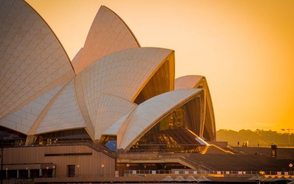The Sydney Opera House is an architectural masterpiece and a global icon of Australia. Located on the beautiful Sydney Harbour, its distinctive white "shells" are recognized worldwide. Visitors can take a guided tour to learn about its history, enjoy a world-class performance, or simply relax at the Opera Bar and take in the stunning views of the Harbour Bridge.