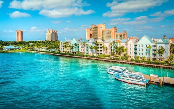 Nassau, the capital of the Bahamas, is a vibrant hub that blends colonial history with modern luxury. Visitors can explore the historic Queen’s Staircase, visit the colorful Straw Market, or relax on the famous Cable Beach. With its lively pastel-colored buildings and bustling cruise port, Nassau offers a perfect mix of culture, shopping, and tropical beauty.