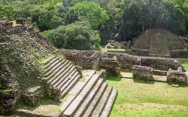 Located deep within the Chiquibul Forest Reserve, Caracol is the largest Maya archaeological site in Belize. Its most impressive structure, the "Caana" (Sky Palace), remains one of the tallest man-made buildings in the country. Visiting Caracol offers a raw and adventurous look into ancient Maya civilization, surrounded by lush jungle and the sounds of tropical wildlife.