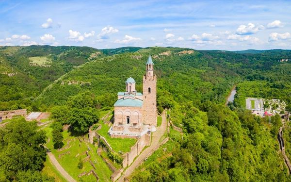 Veliko Tarnovo was the medieval capital of the Second Bulgarian Empire. The Tsarevets Fortress, located on a hill, features massive walls, gates, and the Patriarchal Cathedral. Walking through the ruins offers a sense of the city's past glory. The city is also known for its traditional crafts street and the spectacular "Sound and Light" show that illuminates the fortress at night.