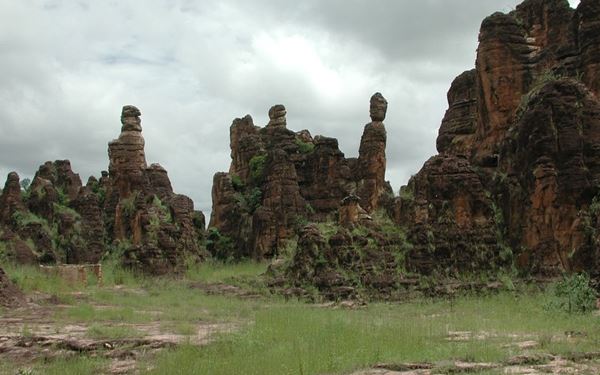 The Peaks of Sindou are a spectacular natural rock formation of jagged sandstone needles carved by wind and water erosion over millions of years. This mystical landscape is considered a sacred place by the local people. Hiking through the peaks at sunrise or sunset offers a breathtaking view of the savannah, making it one of the most stunning and spiritual natural landmarks in the country.