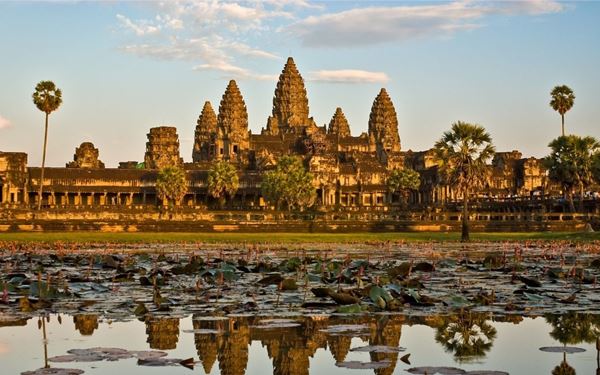 Angkor Wat is the largest religious monument in the world and the heart of the ancient Khmer Empire. Famous for its towering spires and intricate bas-reliefs, the temple complex is most stunning at sunrise. Exploring this UNESCO World Heritage site allows visitors to discover the incredible architectural and artistic achievements of ancient Cambodia in a vast, jungle-fringed park.