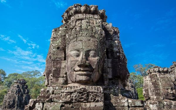 Located at the heart of Angkor Thom, Bayon is famous for the hundreds of massive, serene stone faces carved into its towers. These "smiling faces" are thought to represent the King or a Buddhist deity. The temple’s complex galleries and intricate bas-reliefs depicting scenes of daily life and ancient battles make it one of the most mysterious and captivating structures within the Angkor park.