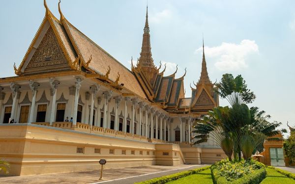 The Royal Palace in the capital city is a stunning example of Khmer architecture with its golden roofs and manicured gardens. The complex includes the Silver Pagoda, named for its floor covered in five tons of gleaming silver tiles. It serves as the residence of the King and remains a symbol of the nation's sovereignty, history, and the enduring beauty of traditional Cambodian design.