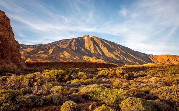 Teide National Park in Tenerife is home to Mount Teide, the highest peak in Spain. This UNESCO World Heritage site features a unique volcanic landscape of craters, vents, and solidified lava flows. Visitors can take a cable car to near the summit for breathtaking views of the archipelago, making it one of the most visited natural wonders in Europe.