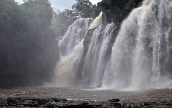 The Boali Falls are a spectacular set of waterfalls on the Mbali River, known for their immense power and beauty. The falls are most impressive during the rainy season when the water crashes down the cliffs. A nearby viewpoint and a suspension bridge offer breathtaking views of the landscape. It is a major natural landmark and a popular destination for those looking to experience the scenic grandeur of the CAR.