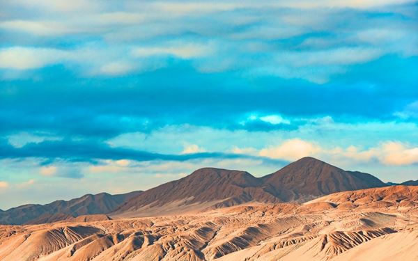 The Atacama Desert is the driest non-polar place on Earth, known for its otherworldly landscapes of salt flats, geysers, and lunar-like valleys. The Valle de la Luna offers stunning sunset views, while the high altitude makes it one of the best places in the world for stargazing. It is a land of extreme beauty and geological wonders.