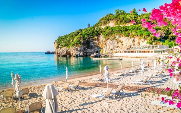 Paleokastritsa is arguably the most famous scenic spot on Corfu, featuring six emerald-green bays surrounded by steep limestone cliffs and olive groves. Visitors can explore sea caves by boat or visit the historic hilltop monastery for panoramic views. The crystal-clear cold waters and lush scenery make it a paradise for swimming and snorkeling, showcasing the dramatic natural beauty of the island.