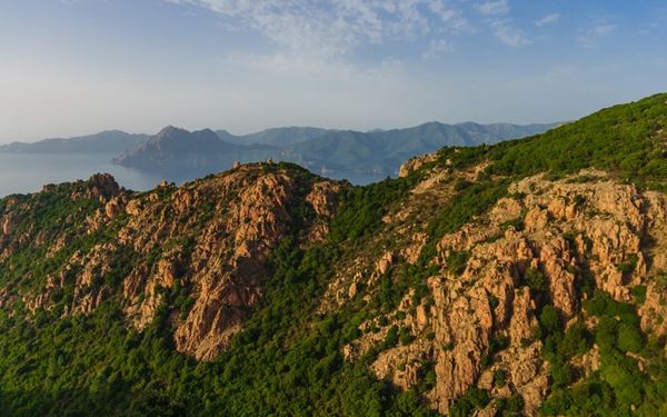 The Calanques de Piana are spectacular red granite rock formations that plunge into the turquoise Mediterranean Sea. This UNESCO site is famous for its jagged spires and arches carved by wind and water. Whether explored by boat or through hiking trails, the dramatic contrast between the fiery red rocks and the deep blue water creates one of the most breathtaking and iconic landscapes in all of France.
