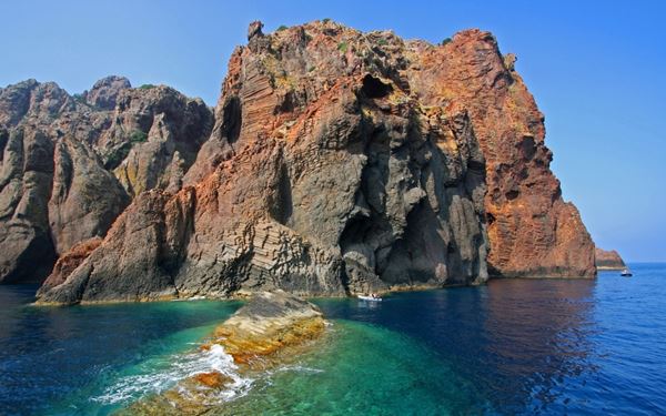 Accessible only by boat, the Scandola Nature Reserve is a pristine coastal sanctuary of volcanic rock, hidden caves, and rich marine life. It is a haven for ospreys and dolphins. The reserve’s untouched beauty and vibrant underwater ecosystems make it a premier destination for eco-tourism. It represents the wild and protected heart of Corsica, offering a serene experience of the Mediterranean's natural splendor.