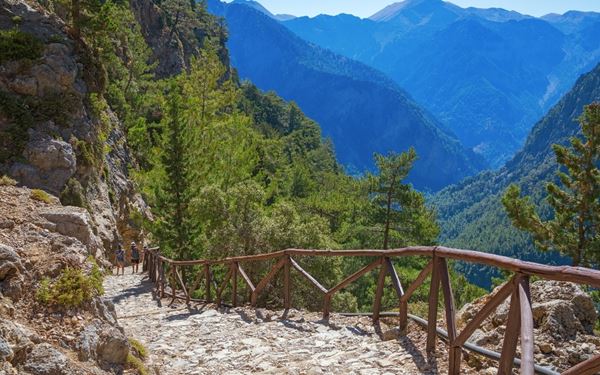 The Samaria Gorge is one of the longest canyons in Europe and a national park of immense beauty. The 16-kilometer trek takes hikers through narrow passages like the "Iron Gates" and lush forests of cypress and pine. It is home to the rare "kri-kri" wild goat. The hike offers a challenging yet rewarding experience of Crete’s rugged mountain interior, ending at the beautiful shores of the Libyan Sea.