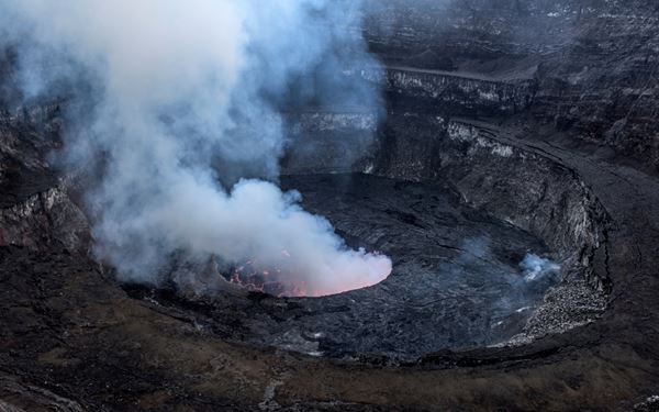 Mount Nyiragongo is an active stratovolcano famous for housing the world's largest persistent lava lake. The trek to the summit offers a breathtaking and surreal sight of the glowing red molten lava against the night sky. It is one of Africa's most exciting geological wonders, providing a rare opportunity to witness the raw, creative, and destructive power of the Earth's interior up close.