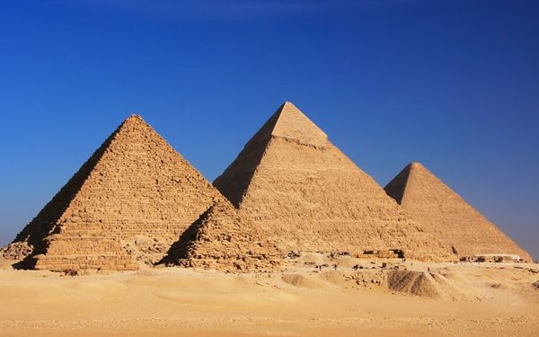 The Pyramids of Giza and the Great Sphinx are the most iconic symbols of ancient Egypt. Built over 4,500 years ago, they are the only surviving wonder of the ancient world. Exploring the desert plateau and the interior chambers of these massive tombs offers a profound connection to human history and the architectural genius of the pharaohs.