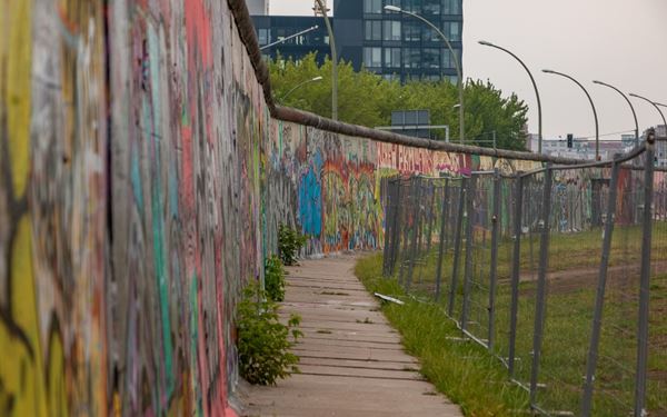 The East Side Gallery is a 1.3 km section of the Berlin Wall covered in over 100 murals by international artists. It serves as a powerful memorial for freedom and a symbol of the Cold War's end. Walking along this historic open-air gallery provides a deep insight into Germany’s past and its vibrant, creative modern spirit.