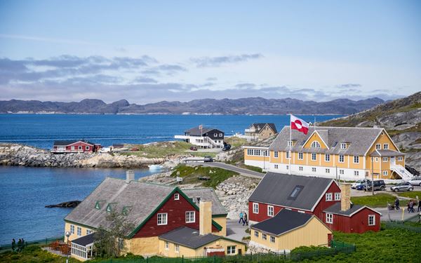 Nuuk, the capital of Greenland, blends modern life with traditional Inuit culture. The Old Harbor is a picturesque area with colorful colonial houses and the statue of the Mother of the Sea. Visitors can explore the Greenland National Museum to see the famous Qilakitsoq mummies. It is the cultural heart of the nation, set against a backdrop of towering mountains and deep fjords.