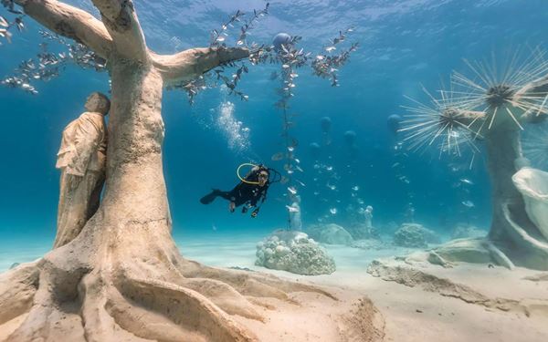 Located in the Molinere Beauséjour Marine Protected Area, this is the world's first underwater sculpture park. Created by artist Jason deCaires Taylor, the life-sized statues serve as artificial reefs for marine life. Snorkelers and divers can explore this unique gallery beneath the sea, where art and environmental conservation merge to create a hauntingly beautiful and vibrant underwater ecosystem.