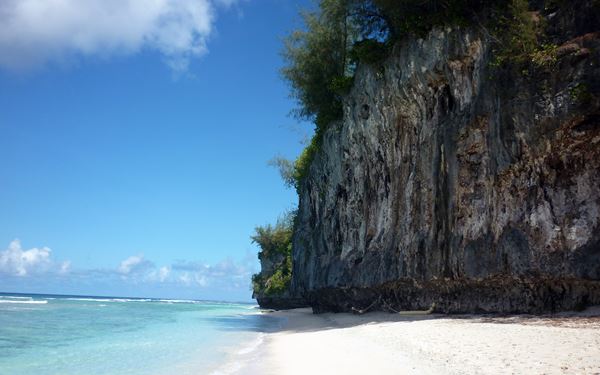 Ritidian Point is a National Wildlife Refuge and home to some of the most pristine white-sand beaches and crystal-clear waters on Guam. Surrounded by limestone cliffs and ancient jungle, it is a haven for native birds and sea turtles. Visitors can explore the nature trails and learn about the indigenous CHamoru culture, experiencing the island’s raw natural beauty in a protected setting.
