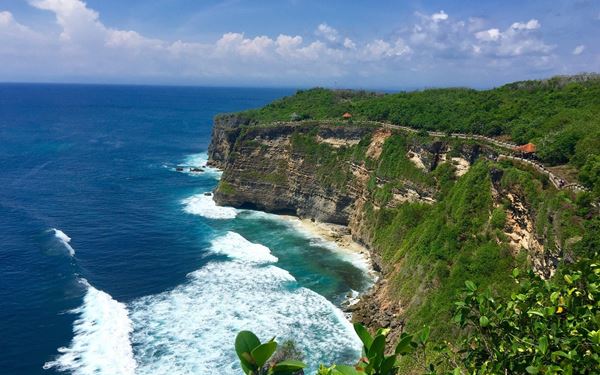 Two Lovers Point (Puntan Dos Amantes) is Guam's most famous landmark, offering panoramic views of Tumon Bay and the Philippine Sea. According to legend, two star-crossed lovers leaped from the cliff to be together forever. It is a romantic spot with a lookout point, a heart-shaped lock wall, and some of the most stunning sunset vistas on the island.