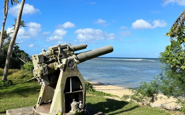 This park commemorates the brave individuals who fought in the Pacific Theater during WWII. It features various sites across Guam, including Asan Beach, where memorials and historic artifacts like coastal guns remain. The park provides a somber and educational experience about the island's role in the war, all set against a backdrop of beautiful coastal and mountain landscapes.