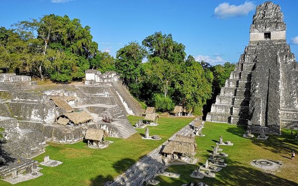 Tikal is one of the most powerful and impressive ancient Maya cities, located deep within the rainforest of northern Guatemala. Its towering limestone temples, like Temple IV, rise above the jungle canopy. As a UNESCO World Heritage site, it offers a fascinating look into Maya history and architecture, surrounded by the sounds of howler monkeys and exotic birds.