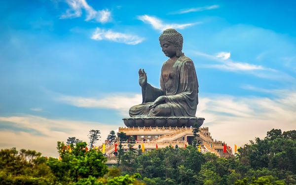 Lantau Island is home to the Tian Tan Buddha, a massive bronze statue that sits serenely atop a hill near the Ngong Ping Village. Visitors can take a scenic glass-bottom cable car ride to reach the site and explore the nearby Po Lin Monastery. It is a place of spiritual reflection and natural beauty, offering a peaceful mountain escape from the bustling city center of Hong Kong.