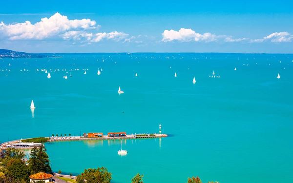 Known as the "Hungarian Sea," Lake Balaton is the largest freshwater lake in Central Europe and a popular summer retreat. The northern shore is famous for its vineyards and the historic Tihany Abbey, while the southern shore offers vibrant resorts and shallow beaches. It is a destination for sailing, wine tasting, and enjoying the relaxed rural beauty of the Hungarian countryside.