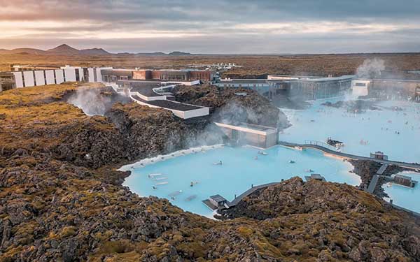 The Blue Lagoon is a world-famous geothermal spa located in a lava field on the Reykjanes Peninsula. Its milky-blue, mineral-rich waters stay at a perfect 38°C year-round. Surrounded by dramatic volcanic scenery, it offers a unique and relaxing experience that has become a symbol of Iceland’s natural beauty and commitment to sustainable wellness.