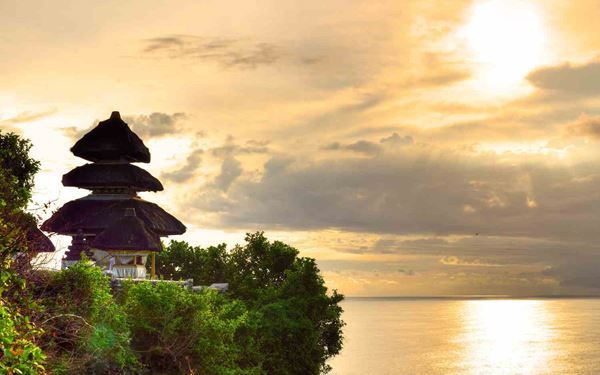 Perched on a steep cliff 70 meters above the Indian Ocean, Uluwatu is one of Bali's most spectacular sea temples. It is famous for its sunset views and the traditional Kecak fire dance performed at twilight. The sound of the crashing waves and the chanting dancers create a powerful and spiritual atmosphere, making it a highlight for culture and scenery in Indonesia.