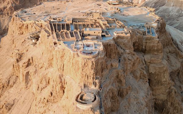 Masada is an ancient fortification perched on a high plateau overlooking the Dead Sea. It is famous for its dramatic history as the last stronghold of Jewish zealots against the Roman Empire. Visitors can hike the "Snake Path" at sunrise or take a cable car to explore the ruins of King Herod’s palaces, experiencing a site of immense archaeological and symbolic importance.