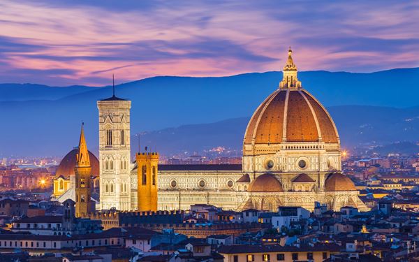 Florence is the cradle of the Renaissance, and its cathedral, the Duomo, is its crowning glory with its massive red-tiled dome by Brunelleschi. The city is a living museum, home to the Uffizi Gallery and Michelangelo’s David. Its art-filled streets and bridges, like the Ponte Vecchio, reflect a period of unparalleled human creativity and the immense wealth of the Medici family.