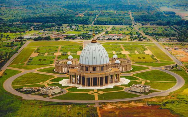 Located in Yamoussoukro, this is the largest church in the world, inspired by St. Peter's Basilica in the Vatican. Its massive dome and extensive use of marble and stained glass are architectural marvels. Standing in the middle of the bush, the basilica is a symbol of national pride and religious devotion, offering a grand and serene atmosphere that is unique on the African continent.