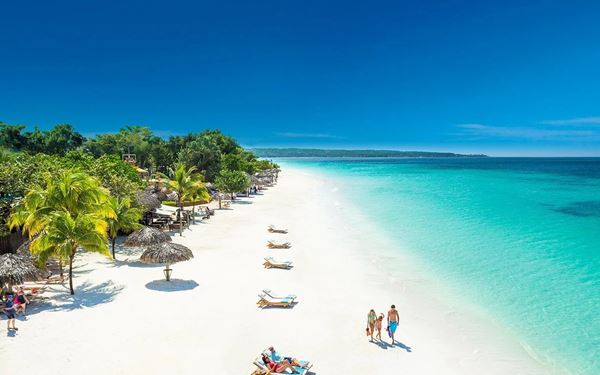 Located in Negril, Seven Mile Beach is a legendary stretch of powdery white sand and shallow turquoise water. It is known for its stunning sunsets, vibrant beach bars, and a relaxed, bohemian vibe. Whether you are sunbathing or enjoying water sports, it offers the quintessential Jamaican island experience in a breathtaking coastal setting.