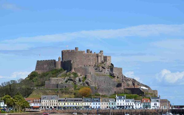 Mont Orgueil Castle, or Gorey Castle, has protected Jersey’s eastern coast from French invasion for over 600 years. Its towering granite walls and hidden rooms offer a fascinating look at the island's medieval history. Climbing to the top of the ramparts provides spectacular views across the sea to the French coast, making it one of the most iconic and picturesque landmarks in Jersey.