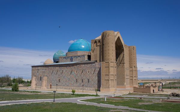 Located in the city of Turkistan, this 14th-century mausoleum is a masterpiece of Timurid architecture and a UNESCO World Heritage site. Its massive blue-tiled dome is one of the largest in the world. It is a significant pilgrimage site for Central Asian Muslims and offers a profound look into the region's spiritual history and the grand artistic style of the Silk Road era.