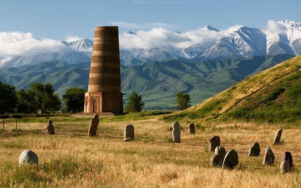 The Burana Tower is a 9th-century minaret and one of the few remains of the ancient city of Balasagun on the Silk Road. The site also features a collection of "balbals" (ancient stone grave markers). Climbing the tower offers views of the Chuy Valley and the surrounding mountains, providing a historical connection to the region's role as a major hub of Central Asian trade and culture.