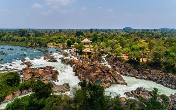 Located in the Mekong River in southern Laos, Si Phan Don is a peaceful archipelago where the river widens and slows down. Visitors can relax in hammocks on Don Det, see the powerful Khone Phapheng Falls, or spot rare Irrawaddy dolphins. It is a place of absolute tranquility, where the "laid-back" lifestyle of Laos is most evident amidst the beauty of the mighty Mekong.