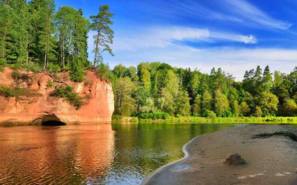 Gauja is Latvia's oldest and largest national park, known as the "Latvian Switzerland" for its scenic sandstone cliffs and the winding Gauja River. The park features medieval castles in Sigulda and Turaida, as well as numerous hiking and biking trails. It is a destination for both history lovers and outdoor enthusiasts, offering a beautiful mix of cultural heritage and pristine northern nature.