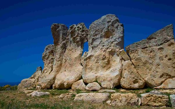 Ħaġar Qim is a megalithic temple complex dating back to 3600-3200 BC, making it one of the oldest religious sites on Earth. This UNESCO World Heritage site features massive limestone slabs and intricate chambers built by a mysterious prehistoric civilization. Overlooking the sea and the islet of Filfla, the temples offer a profound and mystical journey into the dawn of human architectural achievement.