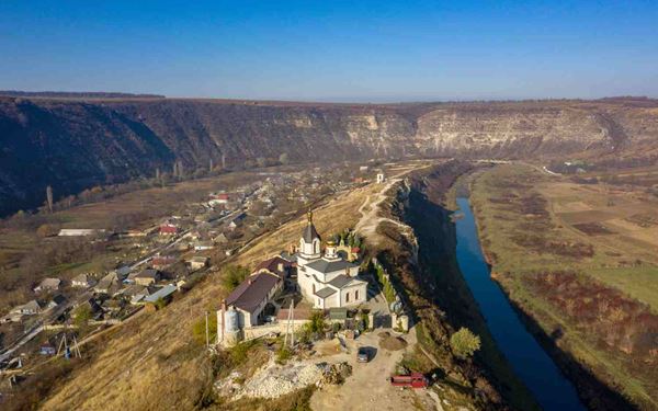 Orheiul Vechi is a spectacular archaeological and historical complex located on a dramatic limestone ridge overlooking the Răut River. It features ancient cave monasteries carved into the rock by Orthodox monks and ruins of a Tatar-Mongol fortress. This site is the cultural heart of Moldova, offering a unique blend of natural beauty, spiritual history, and traditional rural life in nearby villages.
