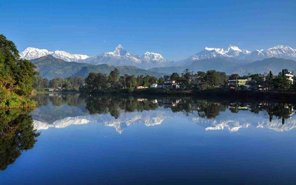 Pokhara is a beautiful lakeside city known as the gateway to the Annapurna circuit. Phewa Lake offers stunning reflections of the Machhapuchhre (Fishtail) peak. Visitors can enjoy boating, paragliding, or hiking to the World Peace Pagoda. Its laid-back atmosphere and breathtaking mountain views make it the perfect place for relaxation and outdoor adventure in Nepal.