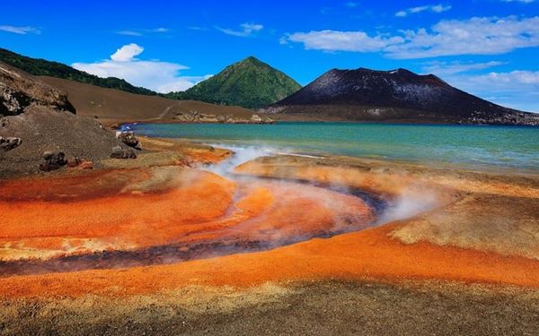 Tavurvur is an active stratovolcano near Rabaul that offers a dramatic and awe-inspiring landscape. Visitors can witness steaming vents and hike across vast fields of volcanic ash. The contrast between the smoking crater and the blue waters of Simpson Harbor is visually stunning. It is a powerful reminder of the earth's raw energy and a unique destination for geological exploration.